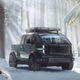 A render of the Canoo pickup truck in a snowy forrest.